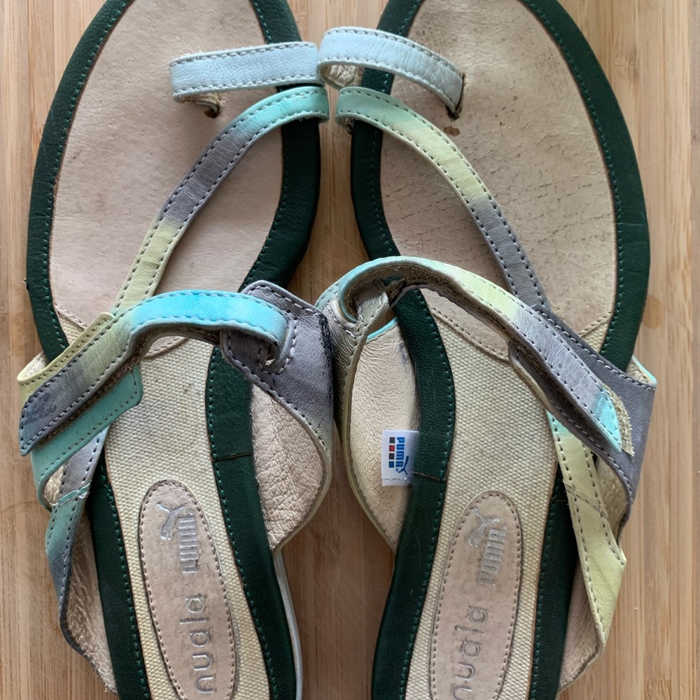 Puma slippers size 37 or a size 6.